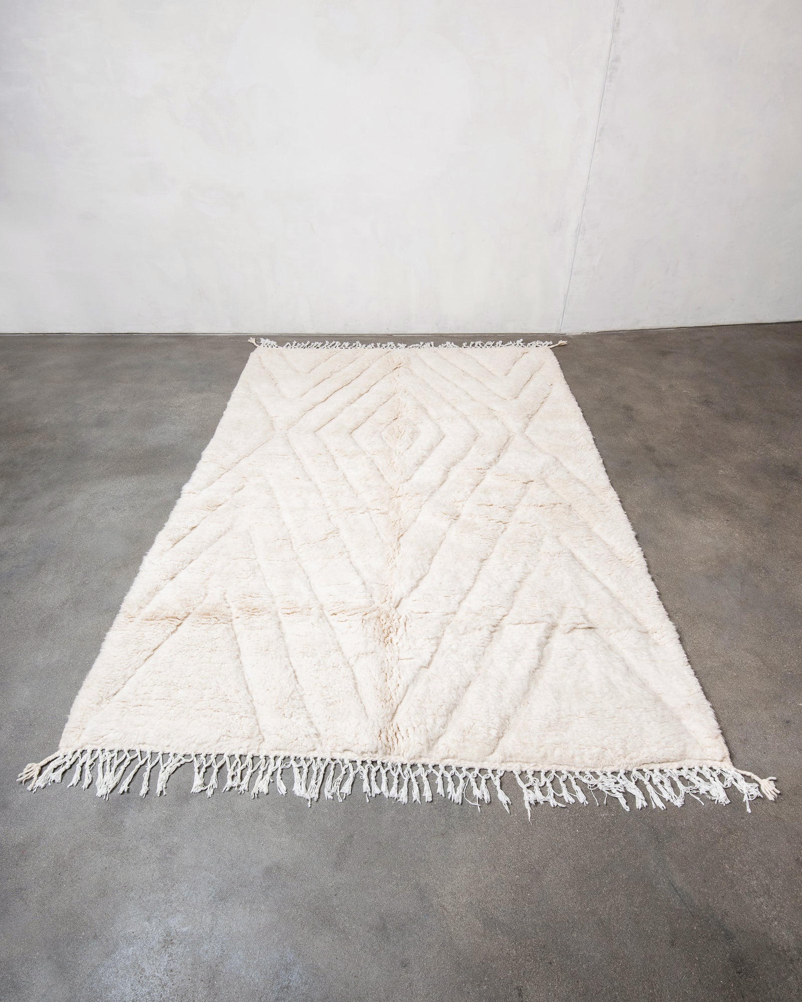 Modern, designer, handcrafted Berber rug from Morocco. Beniourain carpet with beautiful colours and patterns and fluffy wool texture.